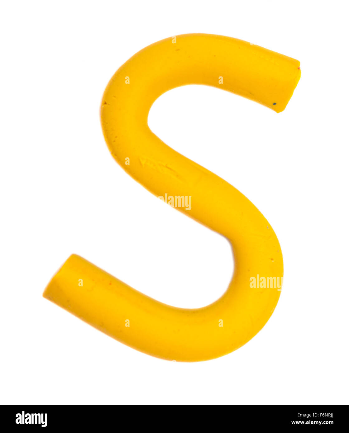 Colour plasticine letter isolated on white background - yellow S Stock ...