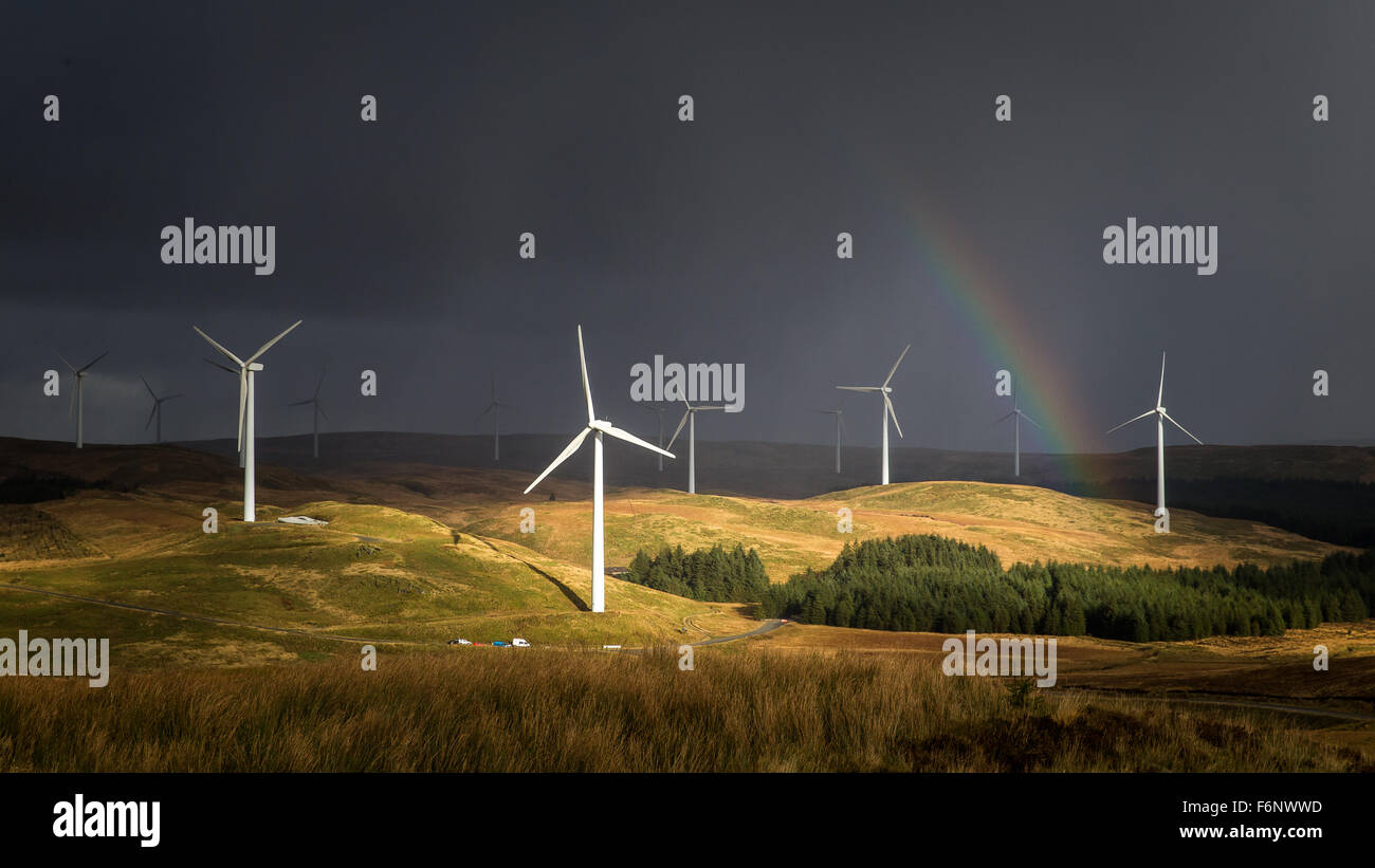 Rainbow and sunlight hit the windfarms on the Myherin stage of Wales Rally GB 2015 Stock Photo