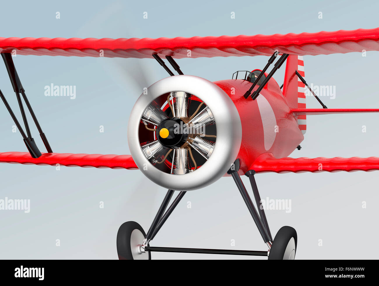 Close up view of red biplane flying in the sky. Stock Photo