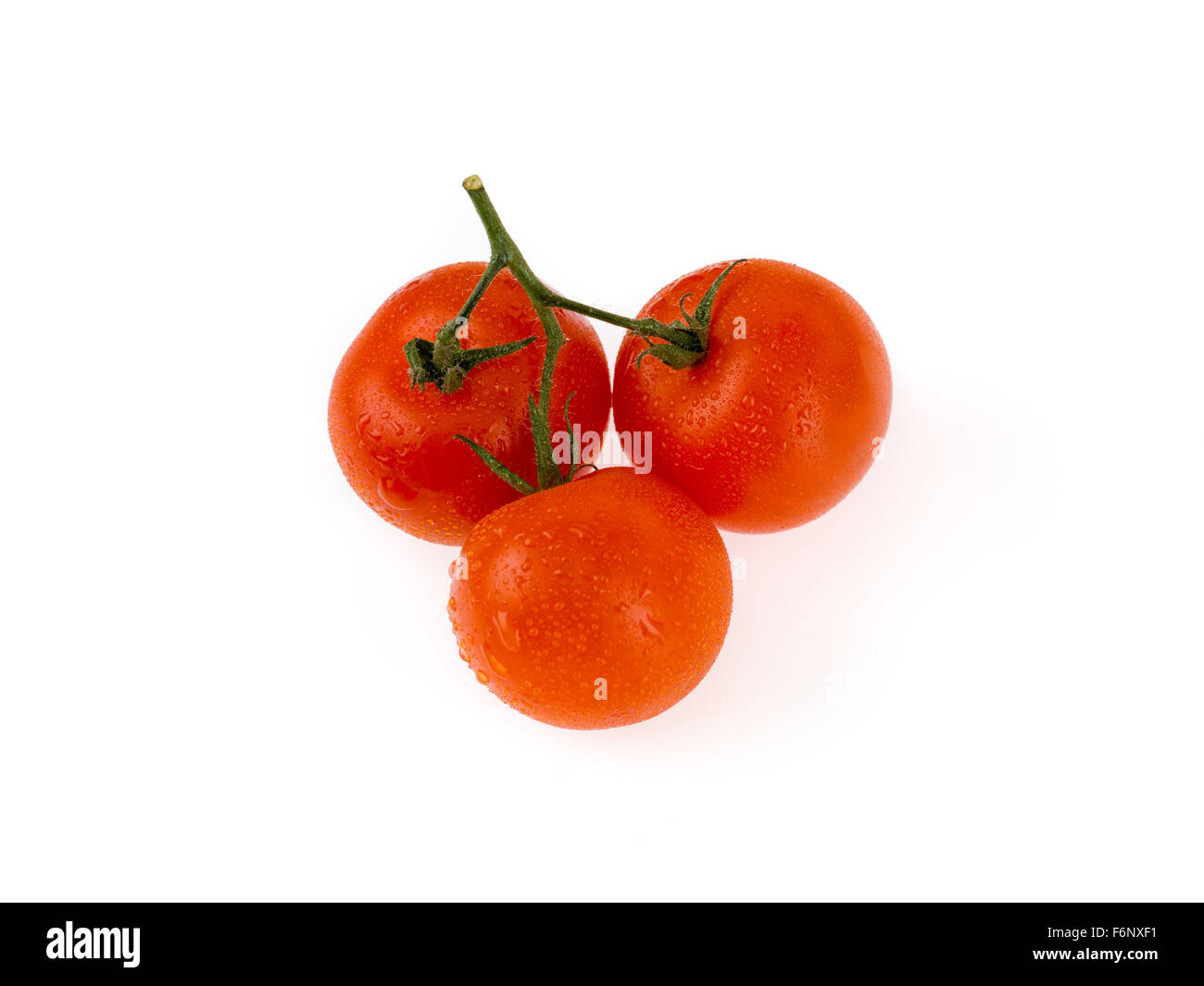 three beautiful tomatos isolated on white background Stock Photo - Alamy