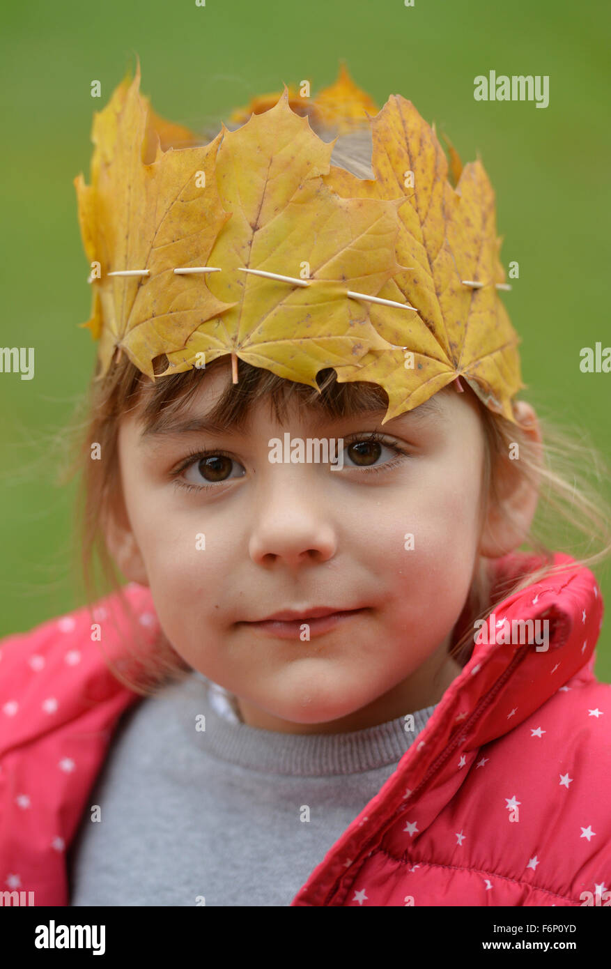 Portrait of a girl wearing a crown of leaves Stock Photo