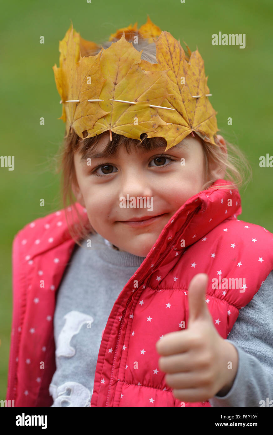 Portrait of a girl wearing a crown of leaves Stock Photo