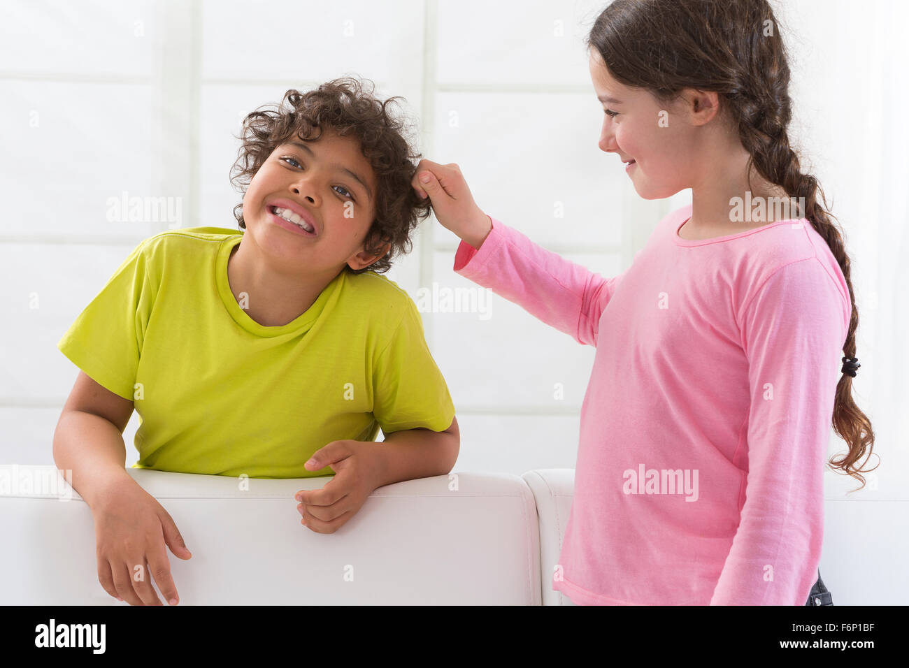 sister pulling brothers hair Stock Photo Alamy