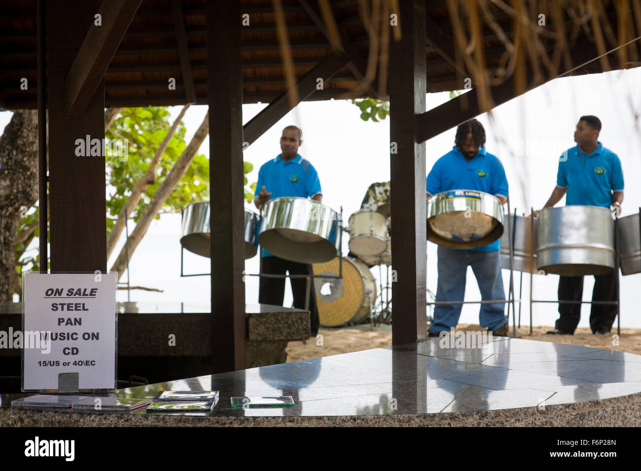 Steel band play on the beach with their backs to the sea in St Lucia ...