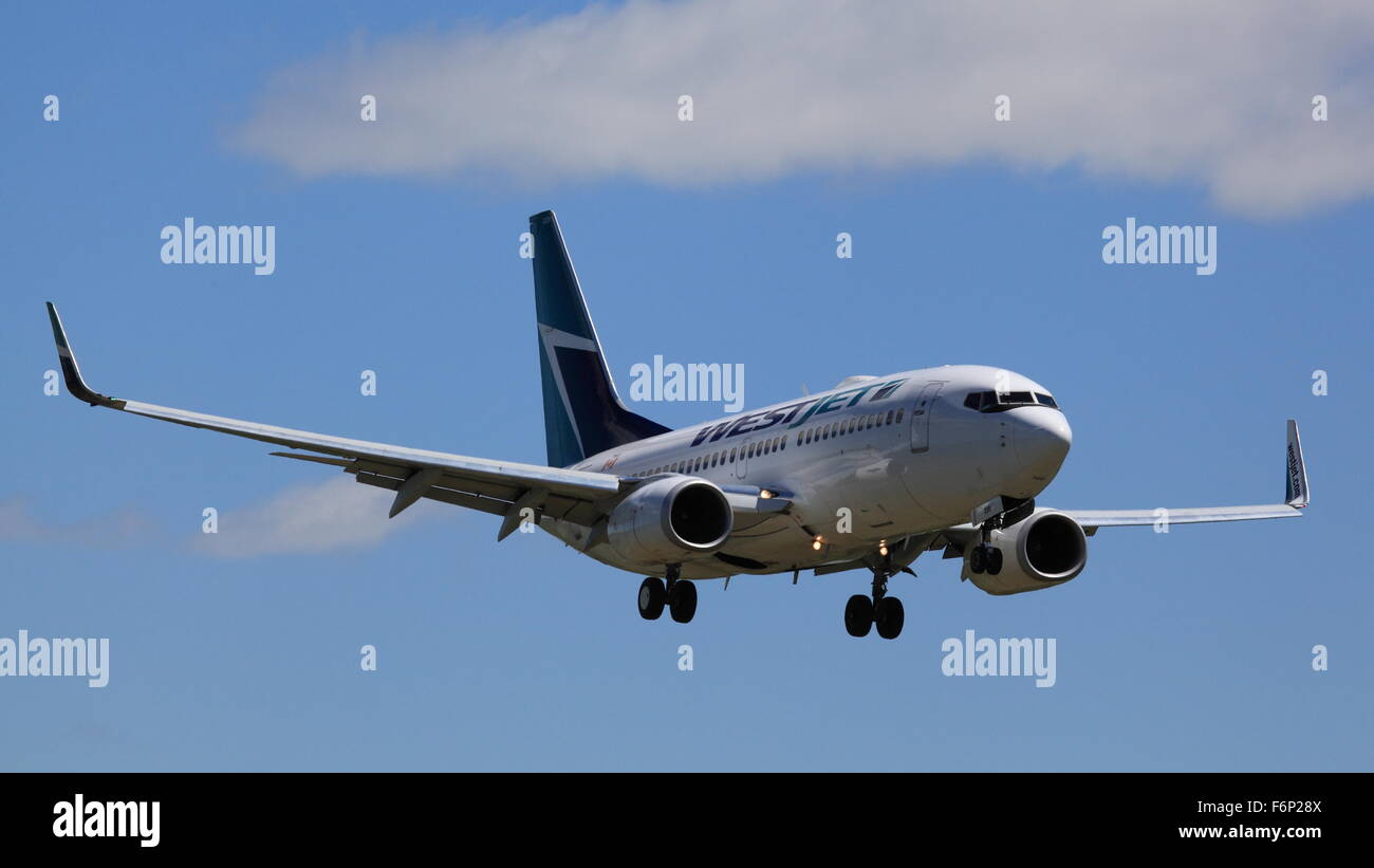 Boeing 737-700 C-FWSV WestJet landing at YOW Ottawa Canada, May 20, 2015 Stock Photo