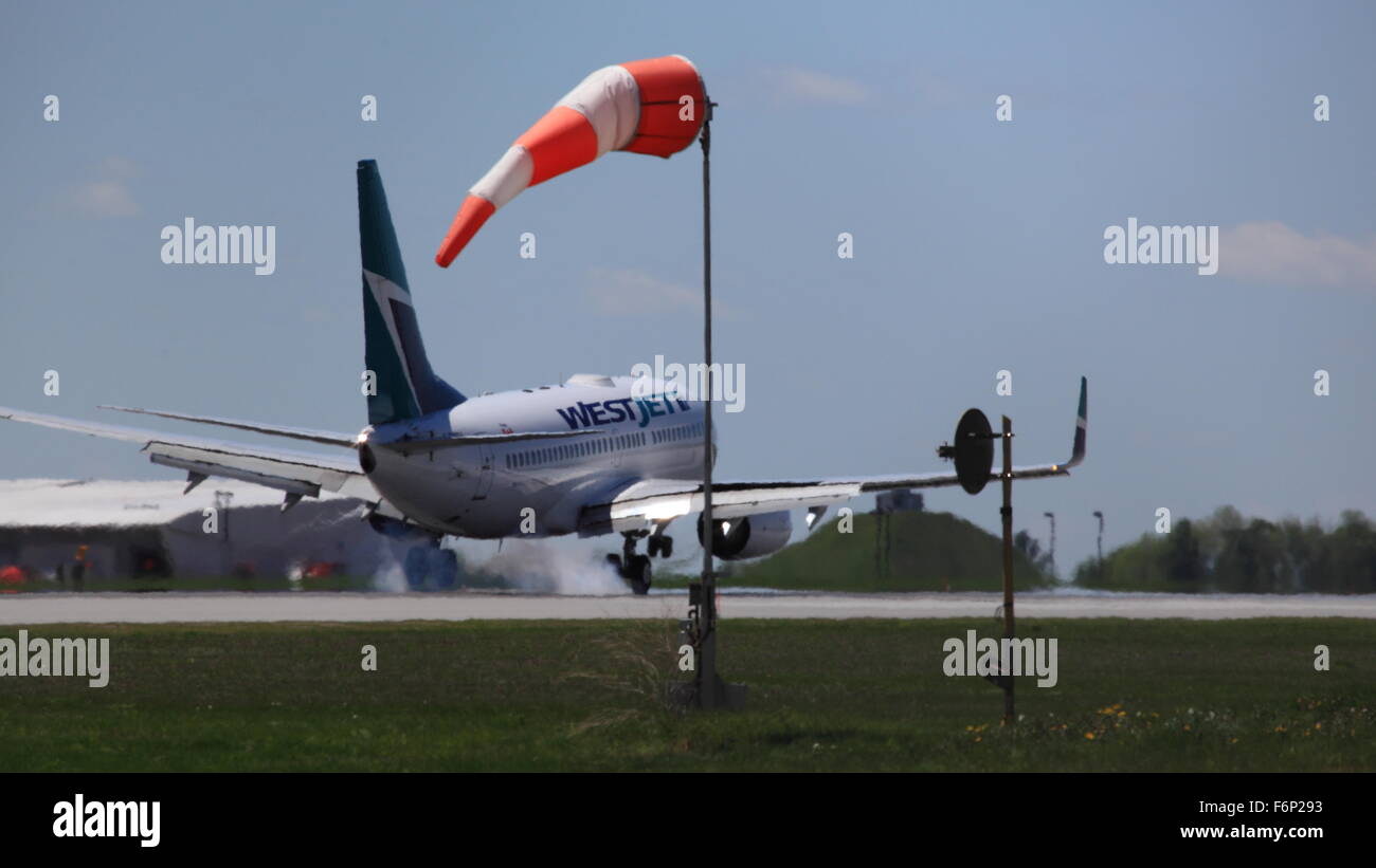 Boeing 737-700 C-FWSV WestJet landing at YOW Ottawa Canada, May 20, 2015 Stock Photo