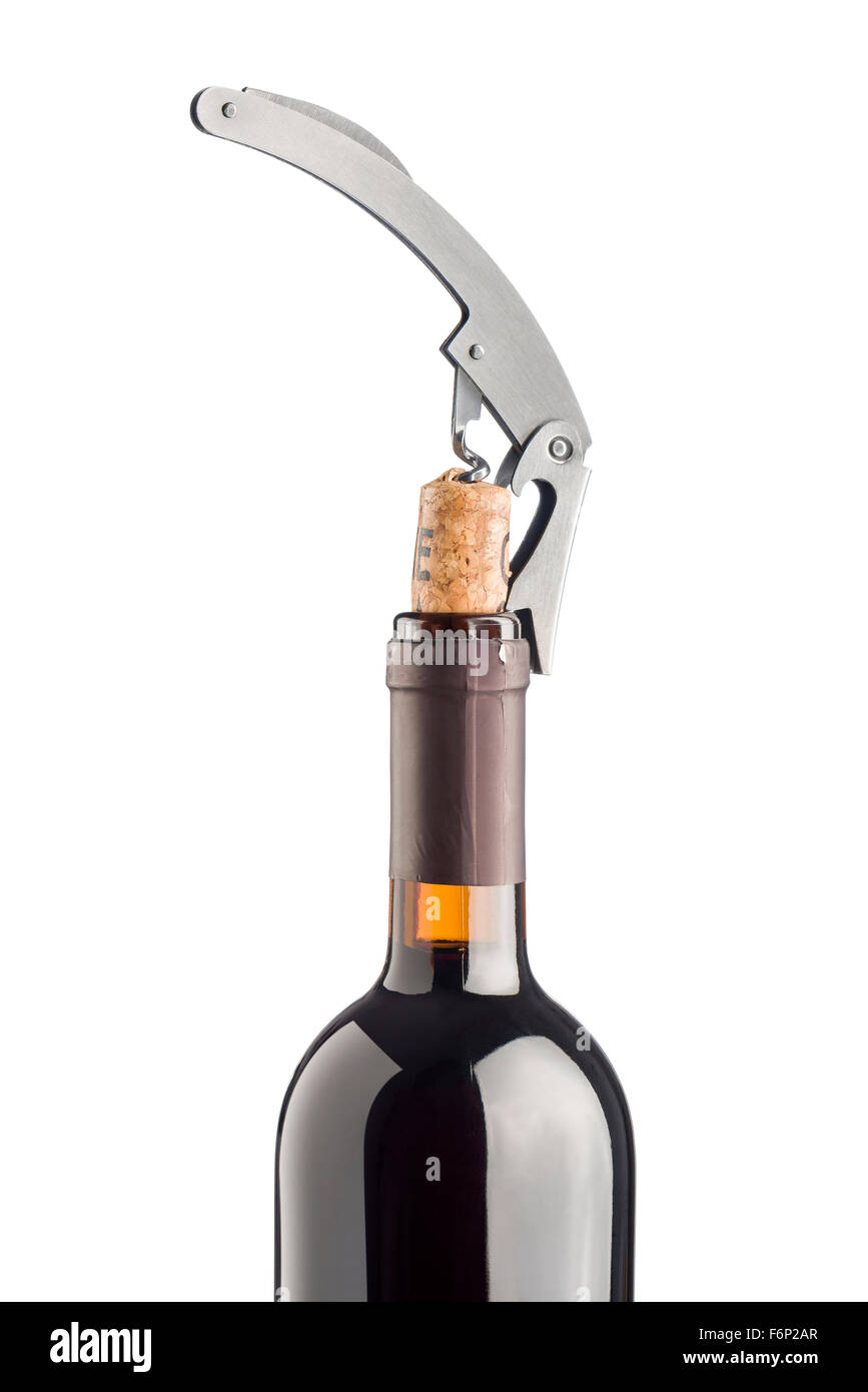 corkscrew inserted on cork into red wine bottle, isolated on white background Stock Photo