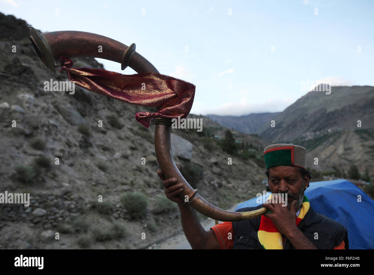 SPITI VALLEY Man playing traditional musical Instrument known as