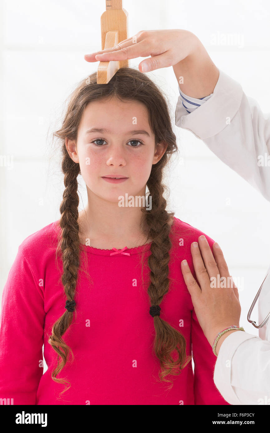 doctor measurement the girl stature Stock Photo