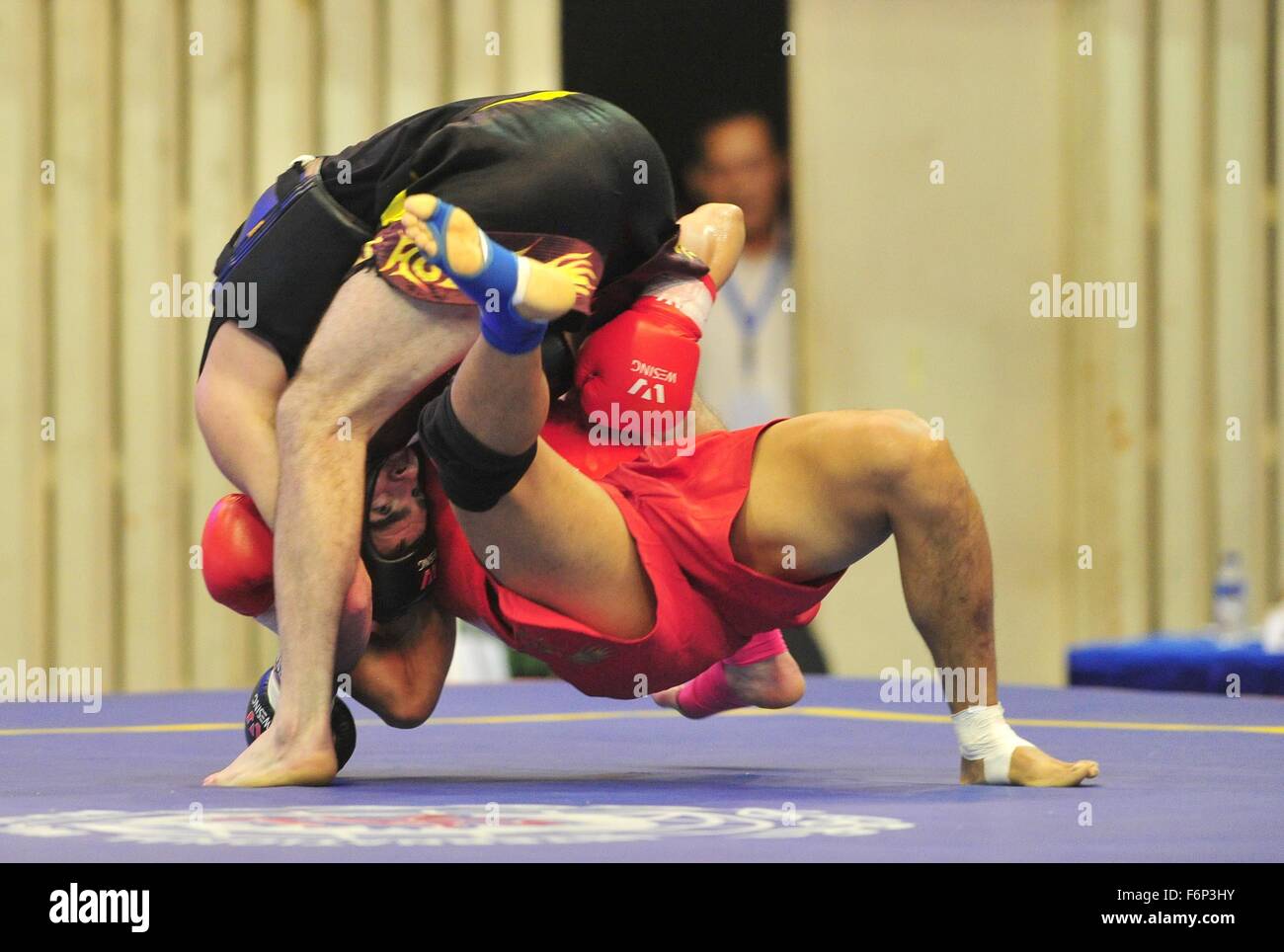 Jakarta, Indonesia. 18th Nov, 2015. Zhang Kun (Bottom) of China fights ...