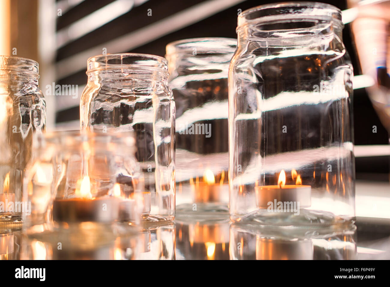 Candles in glass jars Stock Photo