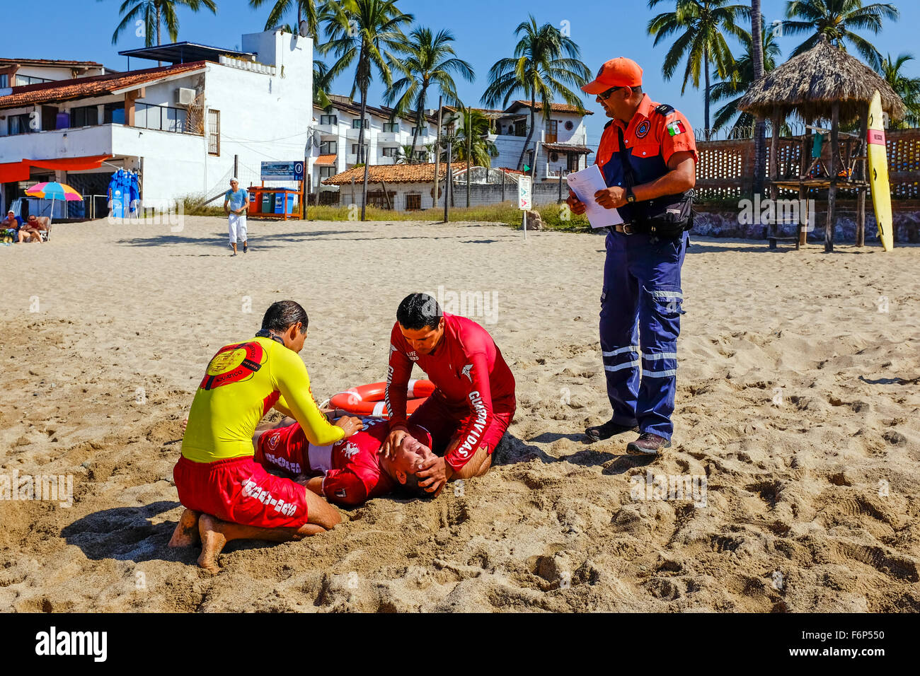 Lifeguards on the beach at Puerto Vallarta, Mexico undergoing training in rescue and lifesaving as part of their licence require Stock Photo