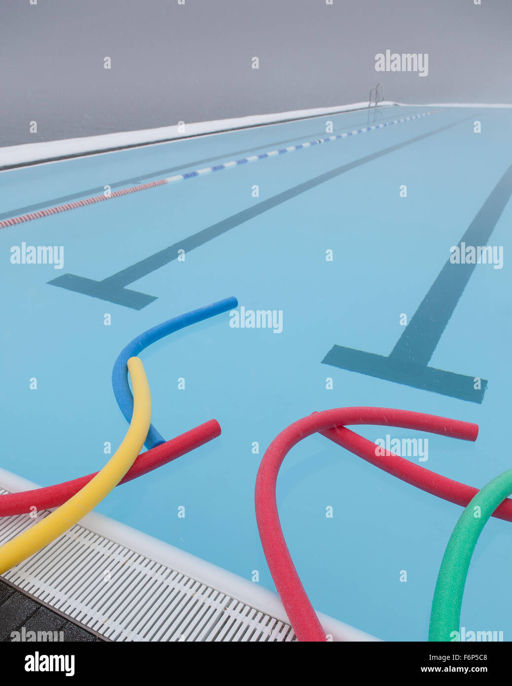 Swim noodles, geothermal heated swimming pool, Wintertime, Iceland Stock Photo