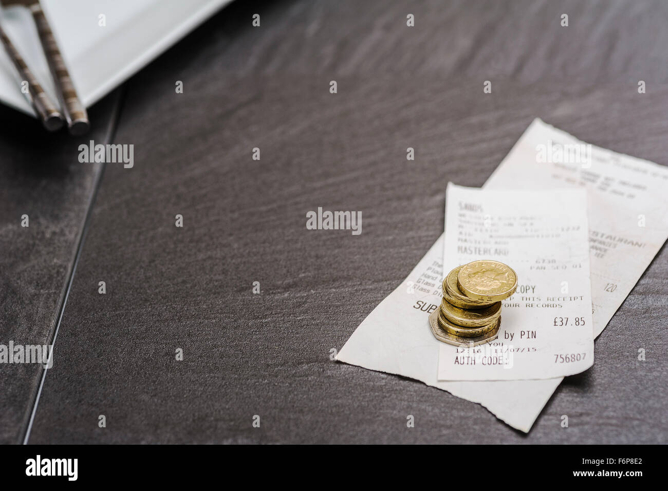 Bill or check with a tip.Restaurant leaving a gratuity and bill paying. Leaving a tip after a meal. Stock Photo