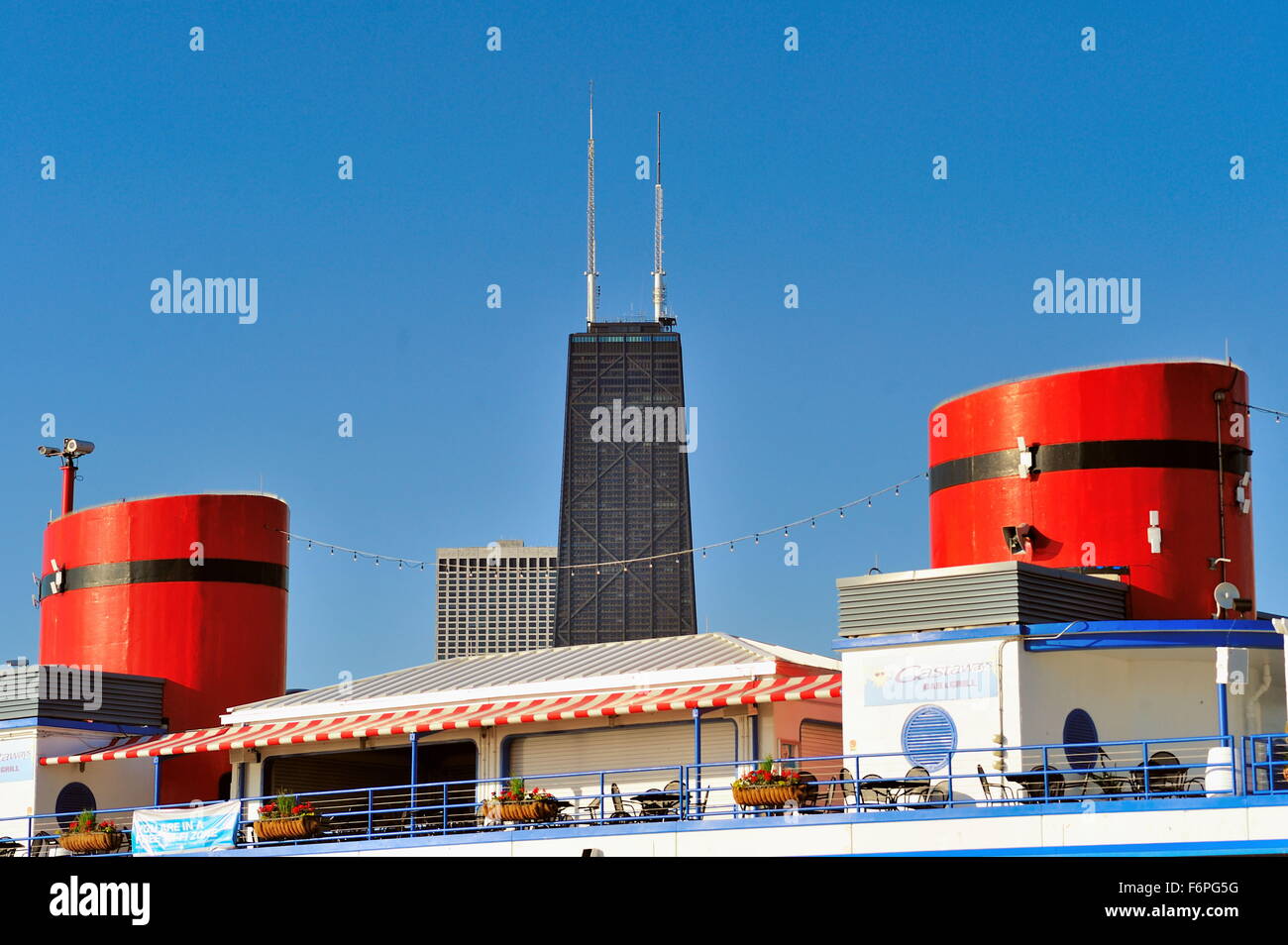 The two stacks on Chicago's North Avenue Beach House bookend the John Hancock Building. The beach house is a city landmark, Chicago, Illinois, USA. Stock Photo