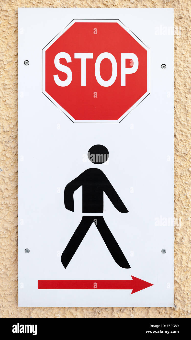 No way, stop sign with schematic black man and red arrow of bypass direction Stock Photo