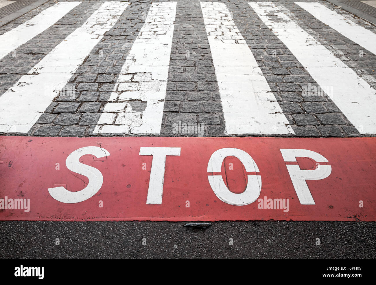 Pedestrian crossing road marking zebra and red stop line on urban road pavement Stock Photo Alamy