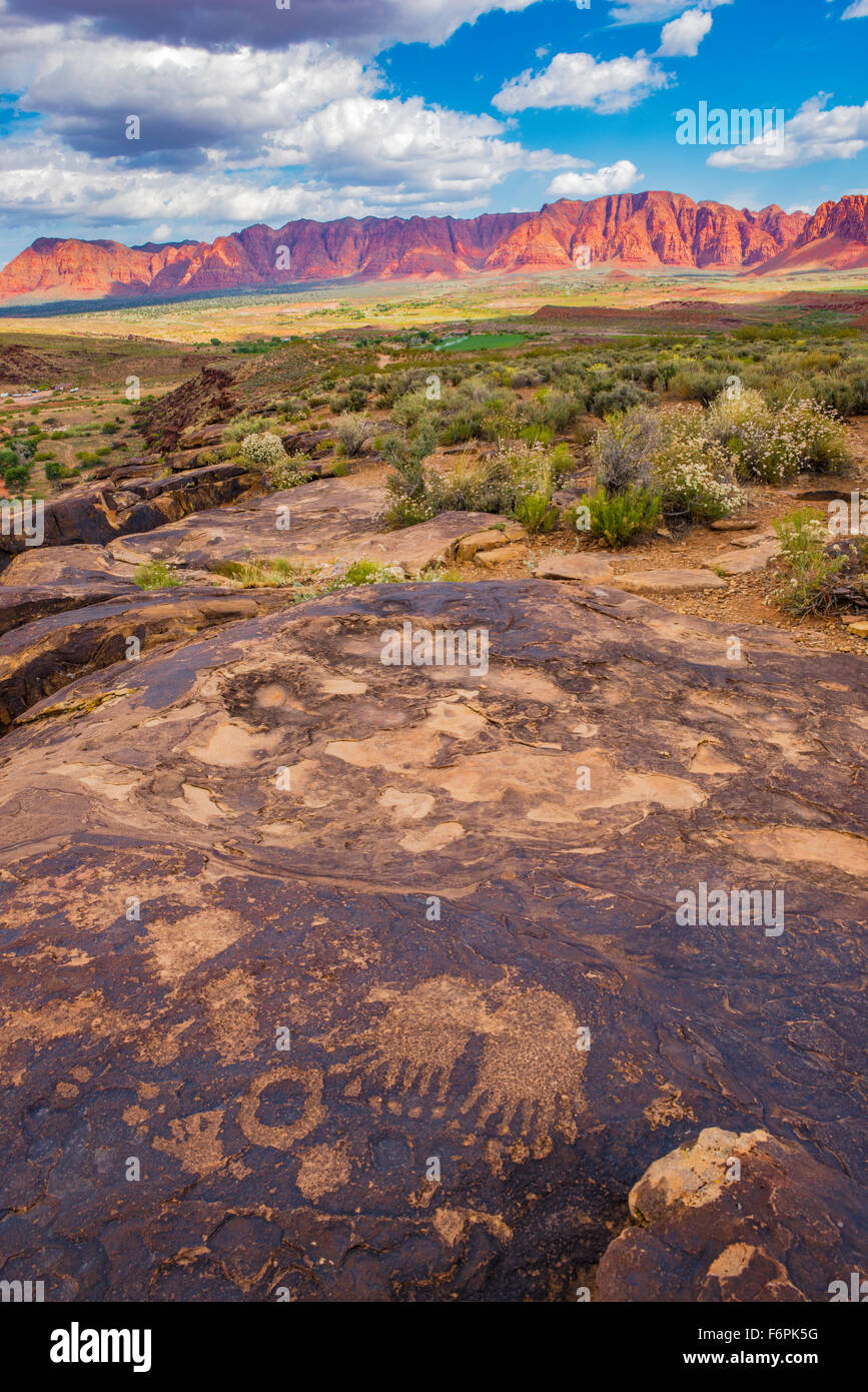 Bear paws petroglyphs and  Red Cliffs, near St. George, Utah Anceint Fremont culture rock art along Santa Clara River Stock Photo