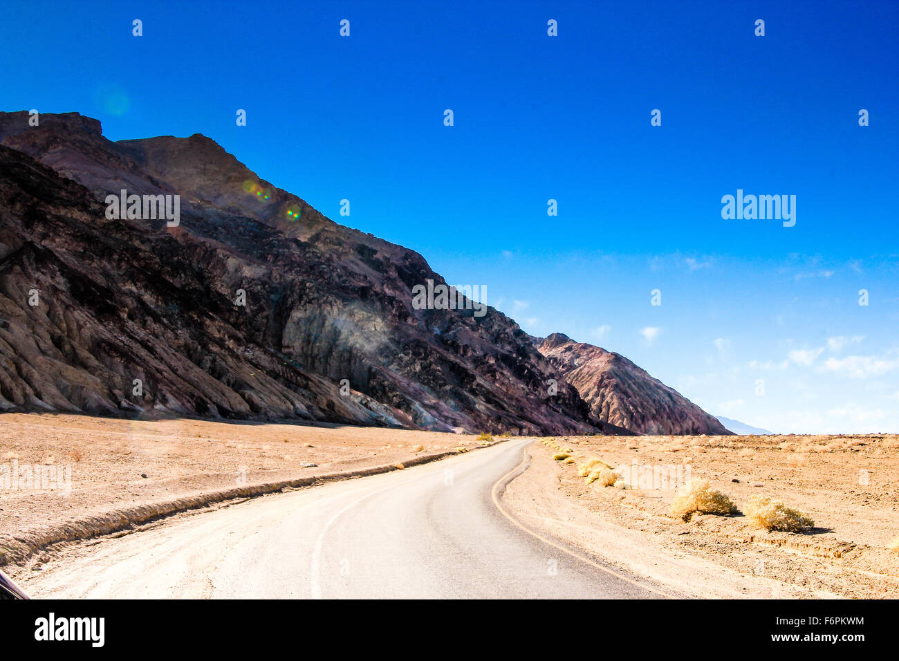 Empty desert highway in Death Valley National Park, California, USA. Stock Photo