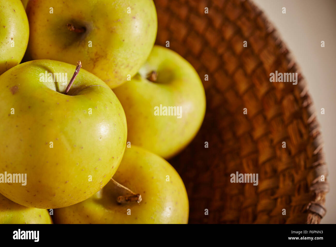 A wicker basket of gold rush apples Stock Photo Alamy