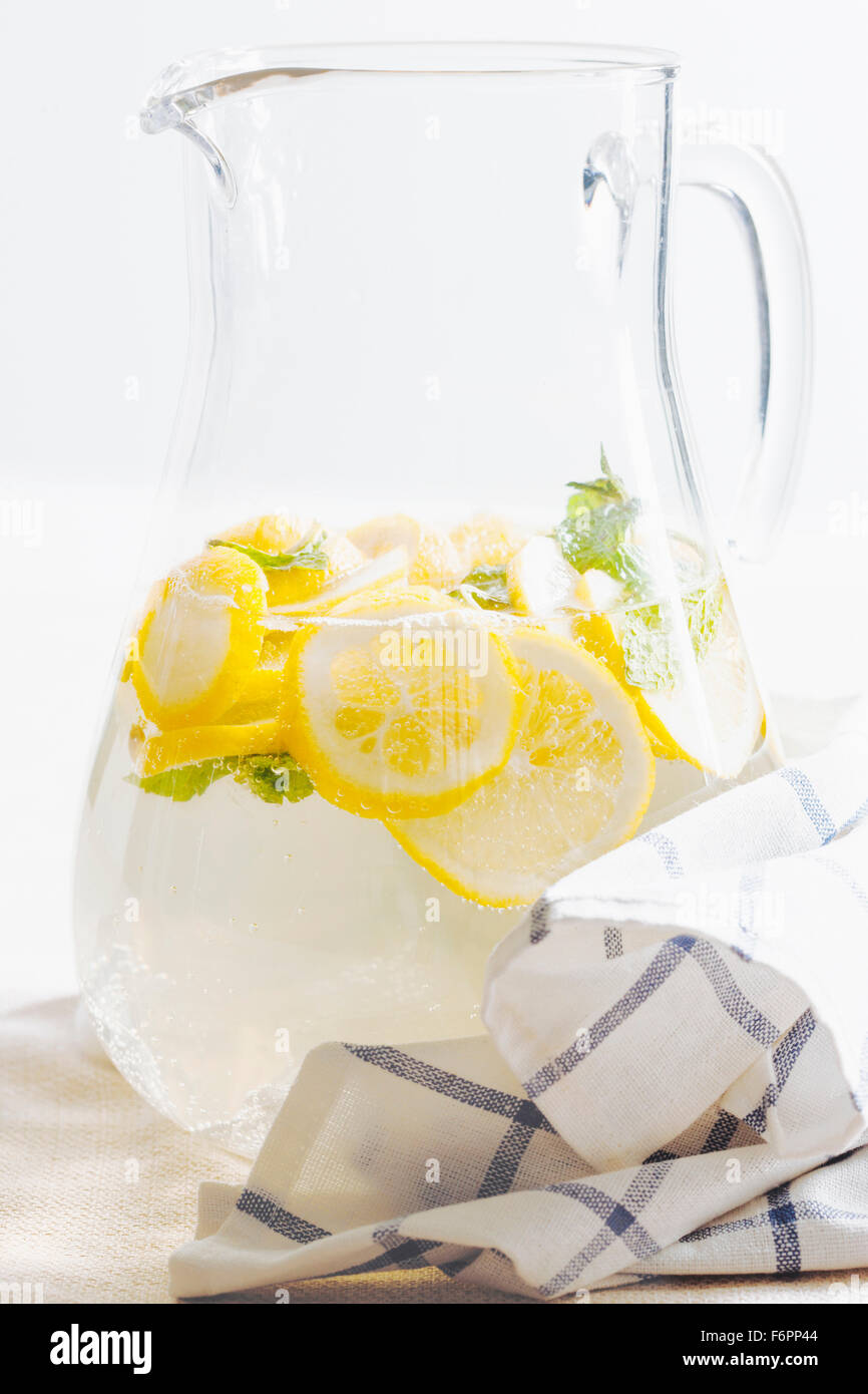 Pitcher of herbal lemon water Stock Photo Alamy
