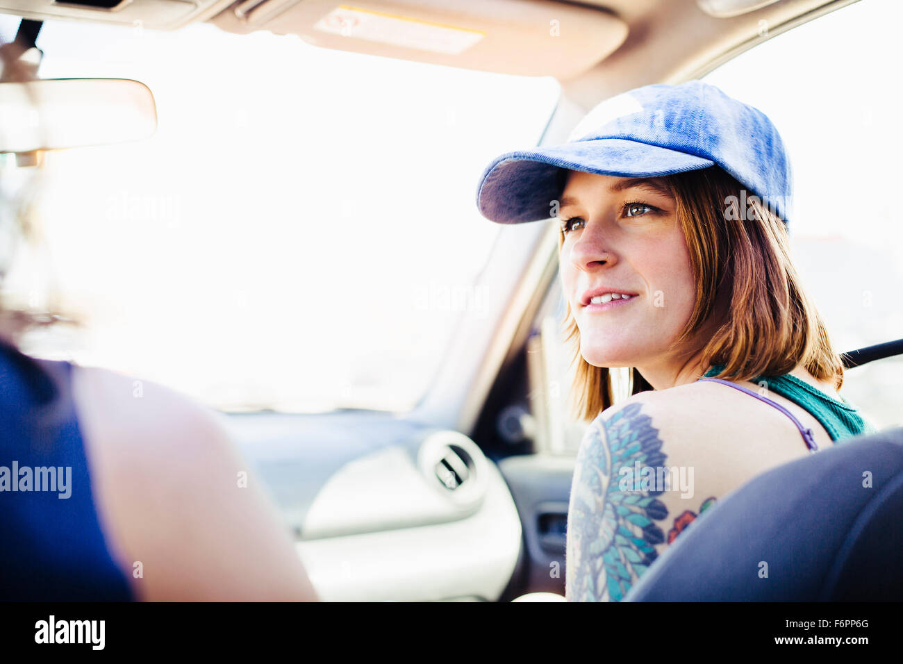 Caucasian couple driving in car on road trip Stock Photo