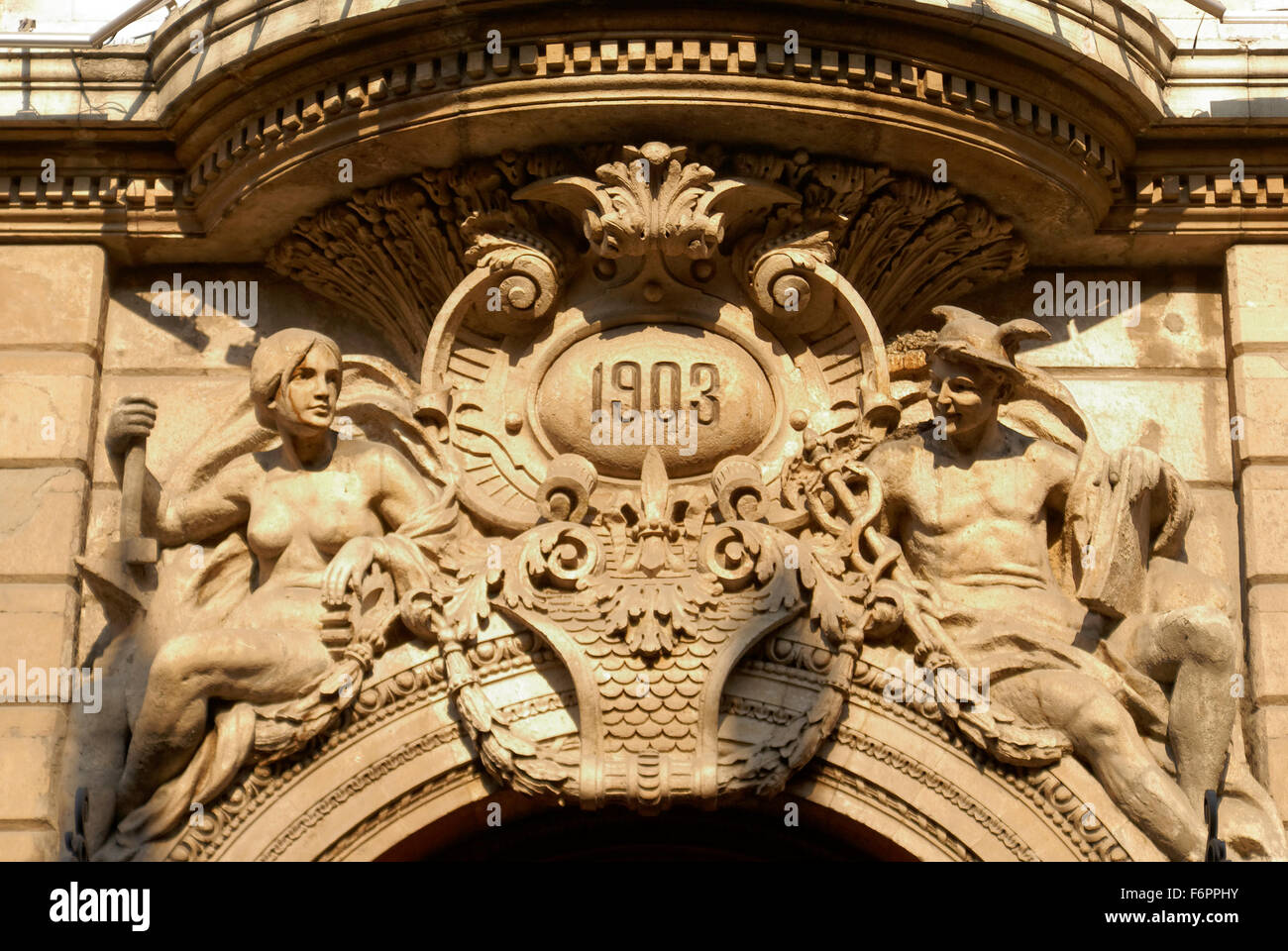 Ornate sculpture with figures representing industry and commerce above the door of the Casino Espanol building, Centro Historico, Mexico City Stock Photo