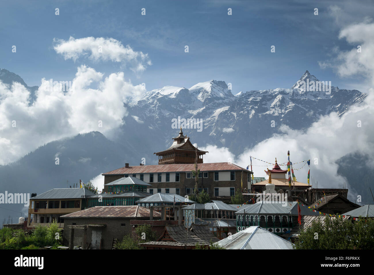 Kalpa village set against clouded Himalayan mountains in the Kinnaur district of Himachal Pradesh, Northern India, Stock Photo