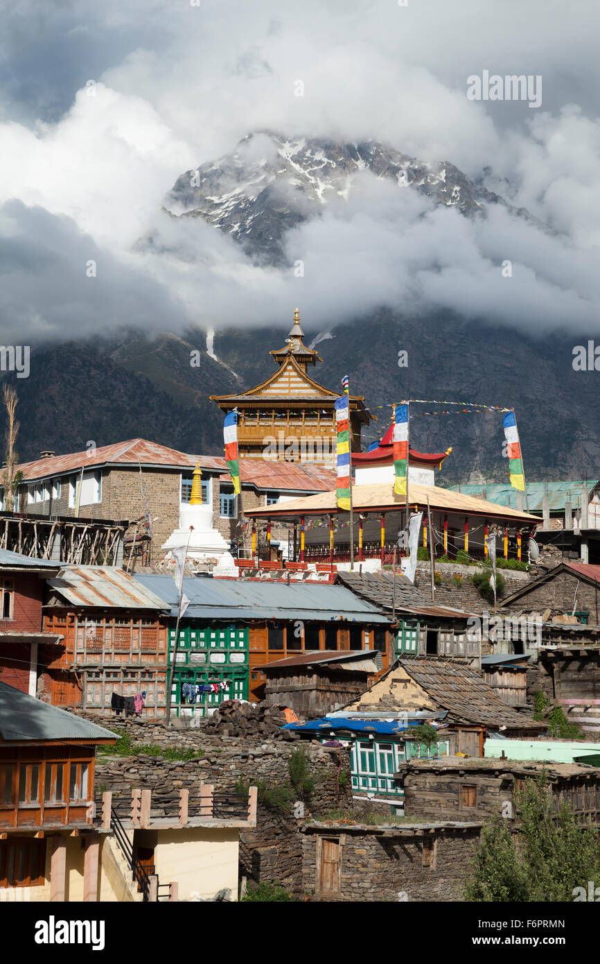 Kalpa village set against clouded Himalayan mountains in the Kinnaur district of Himachal Pradesh, Northern India, Stock Photo