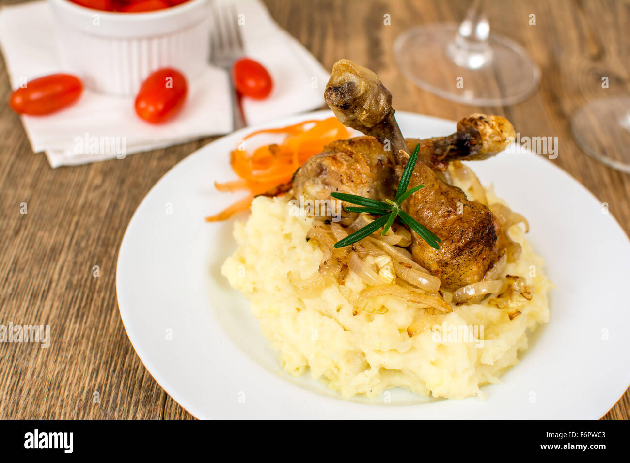 Grilled chicken thigh or leg with potato mash Stock Photo
