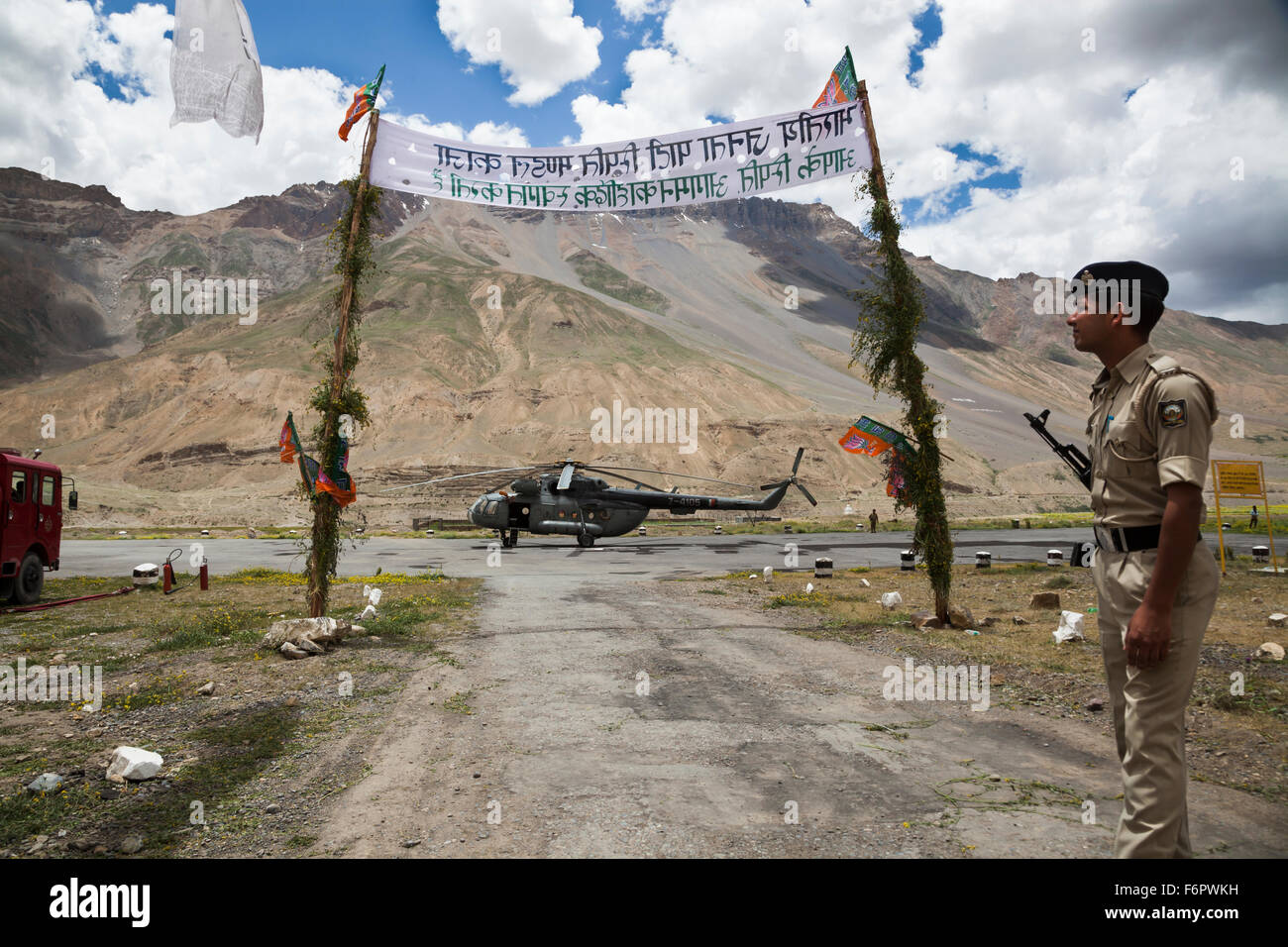 Soldier guards helicopter of the Indian Border Security Force at Kaza in the Himalayan region of Himachal Pradesh, India Stock Photo