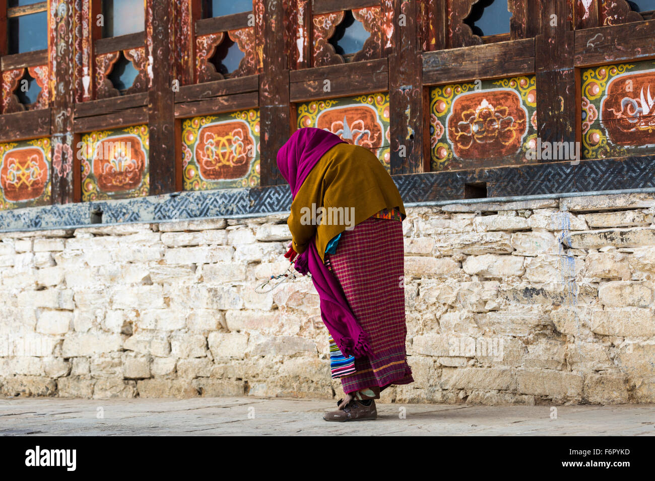 Woman at the temple at Ura, Bumthang, Bhutan Stock Photo