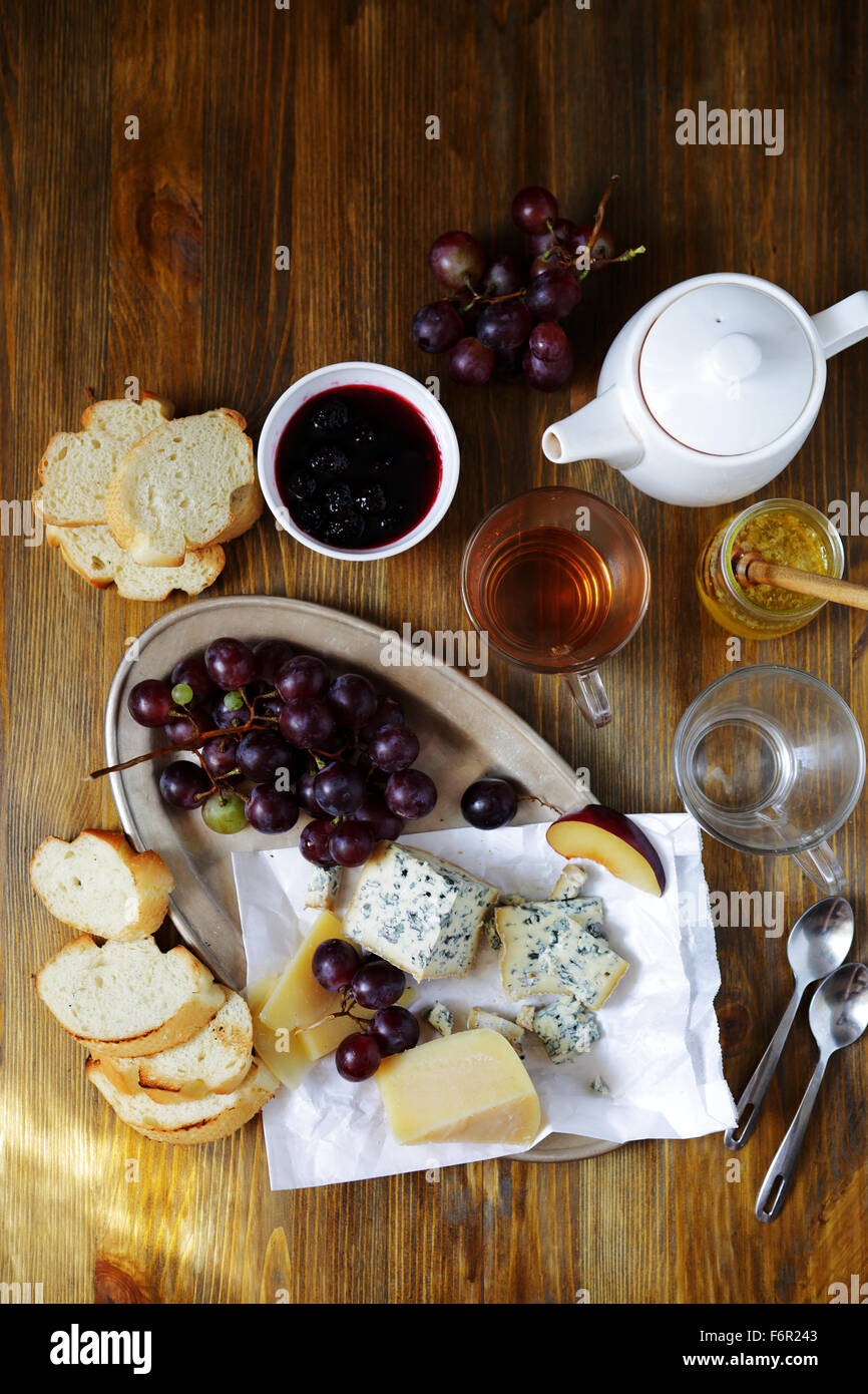 cheese with grapes on breakfast table, top view Stock Photo Alamy
