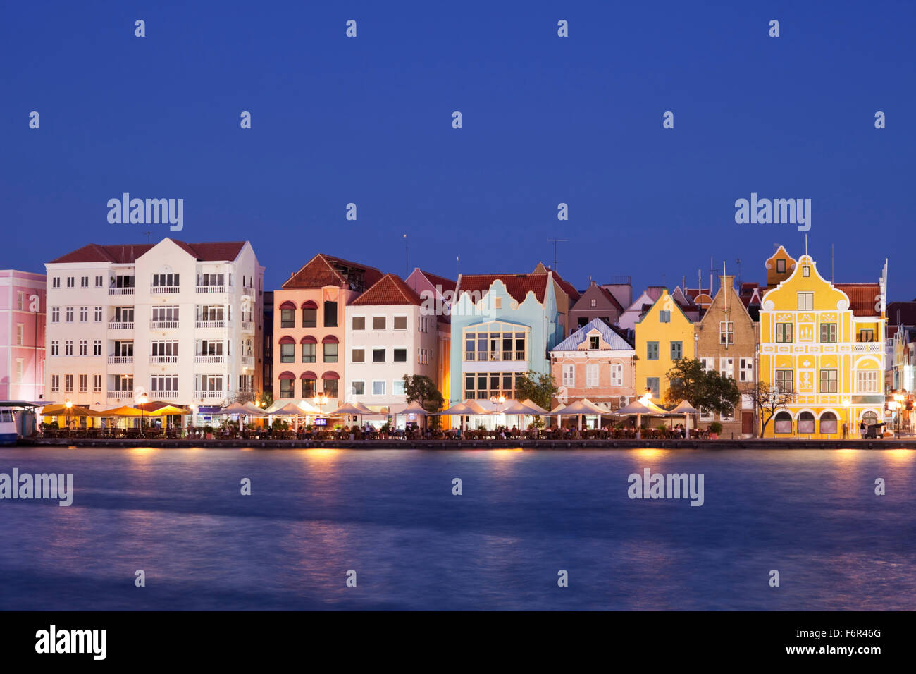 The coloured houses of Willemstad, Curaçao in the Netherlands Antilles by night. Stock Photo