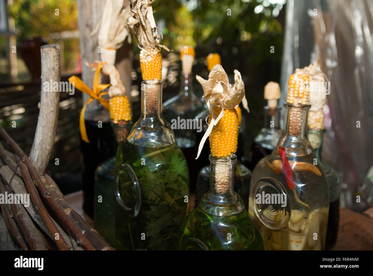 Bottles with alcohol sealed stoppers of corn Stock Photo Alamy