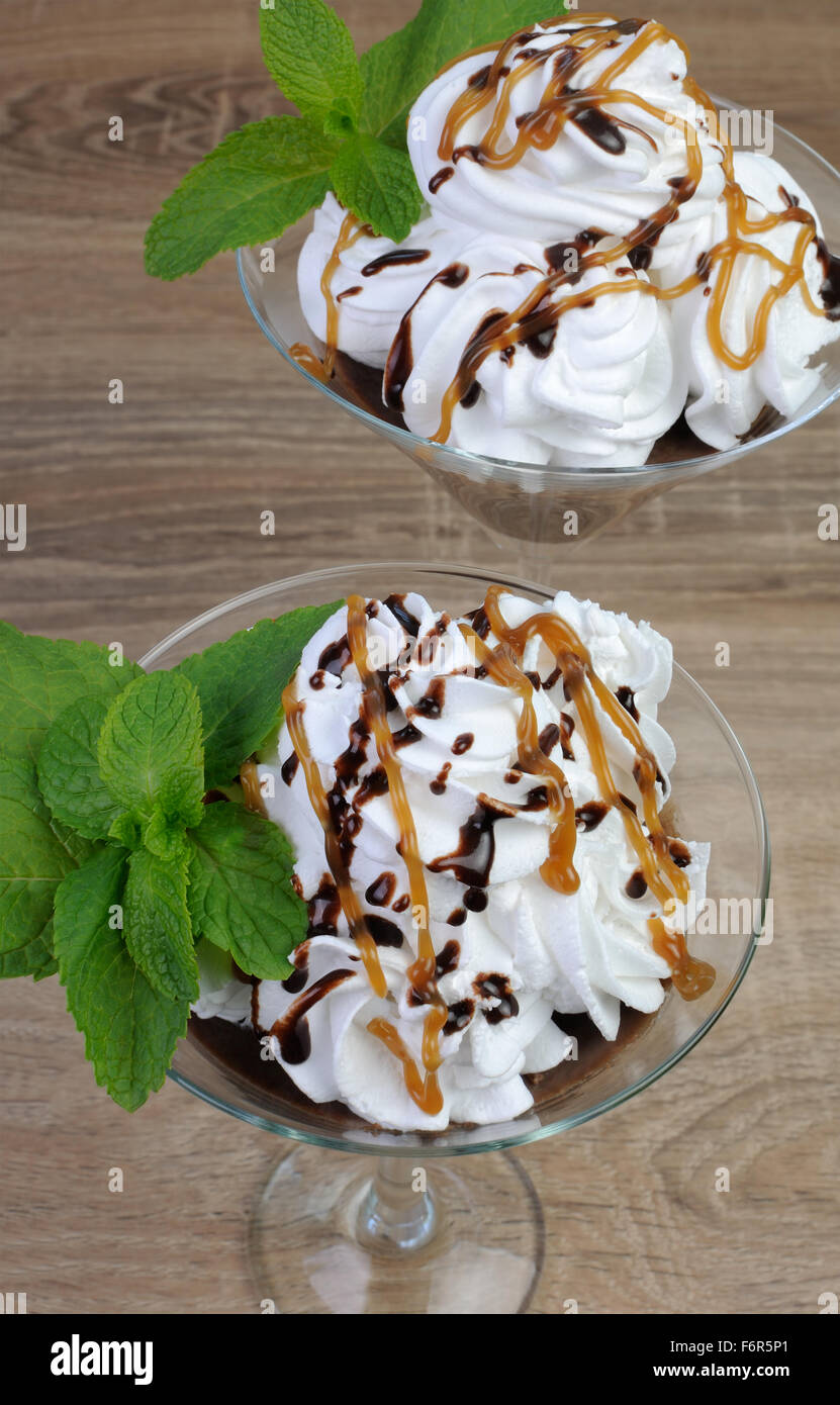 Chocolate dessert with whipped cream drizzled with topping Stock Photo