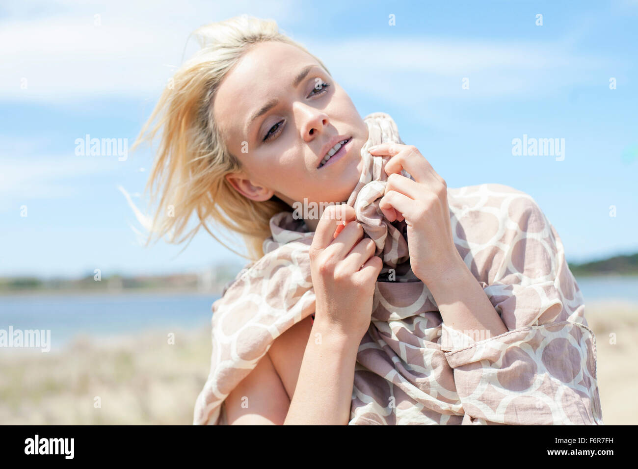 Young woman wrapped in a blanket Stock Photo