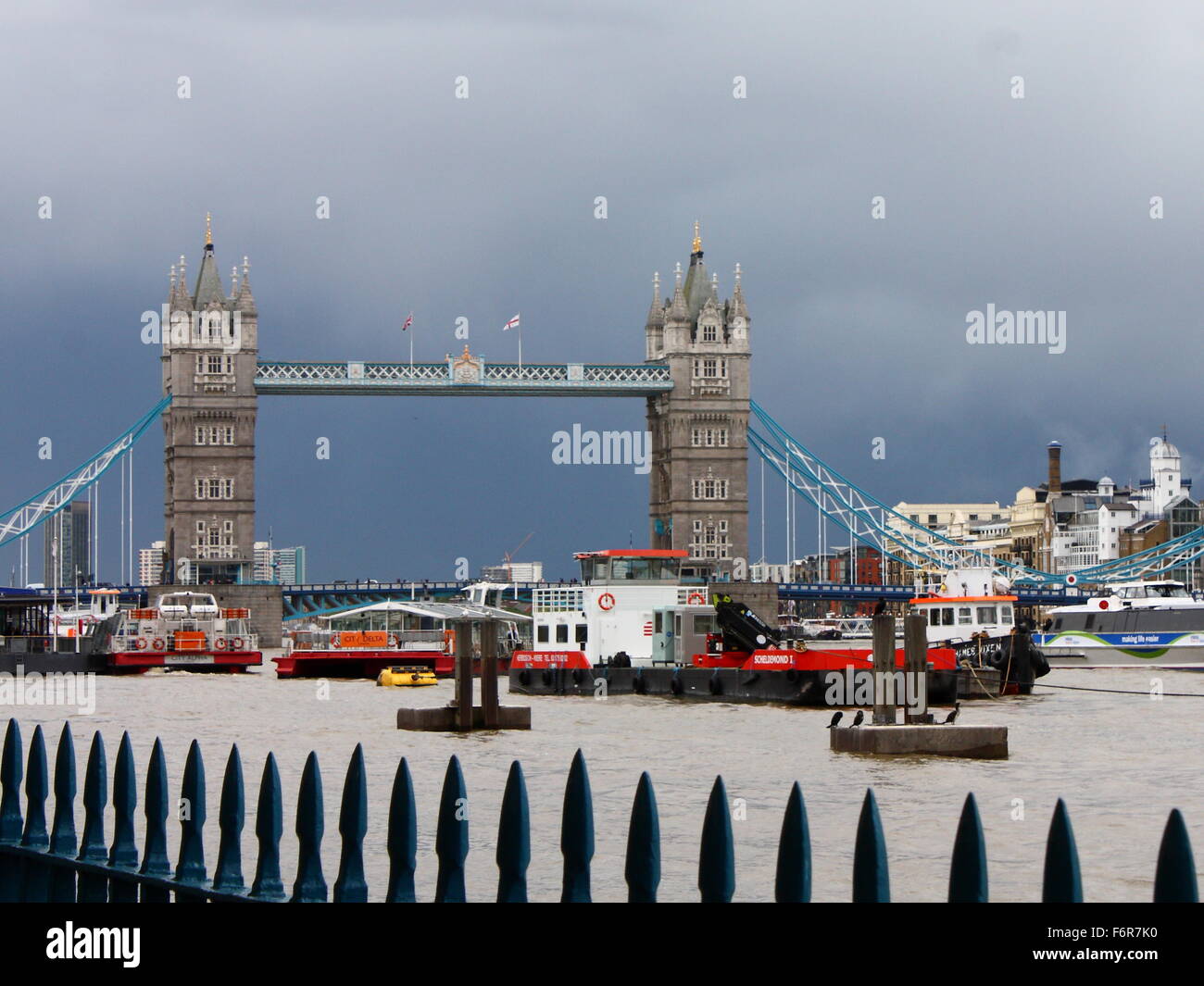 Tower Bridge with a dark sky in the background, London, UK Stock Photo