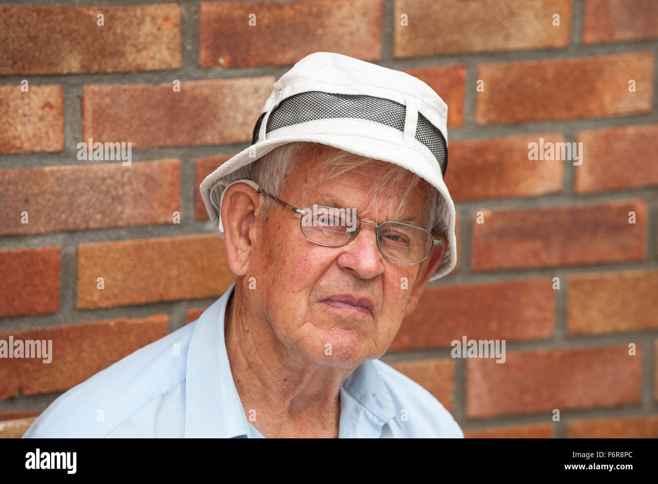 A white British man in his 80's wearing a sun hat in the Uk Stock Photo