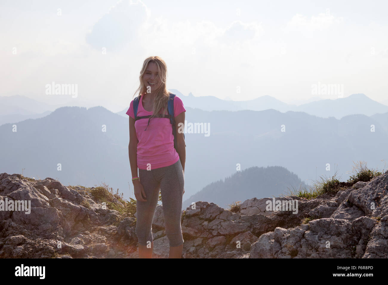Young woman hiking in mountain landscape Stock Photo - Alamy