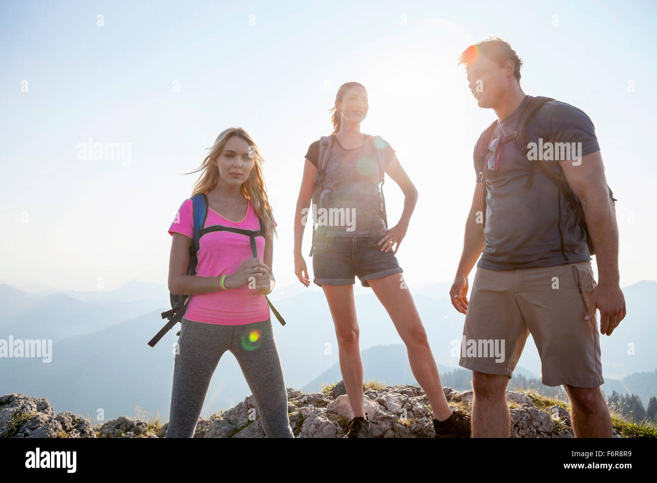 Group of friends hiking in mountain landscape Stock Photo - Alamy