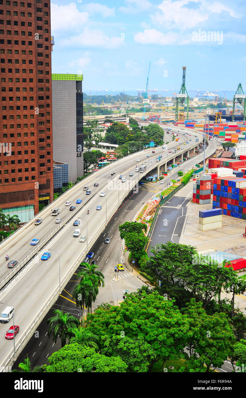 Modern highway and commercial port with many containers in Singapore Stock Photo