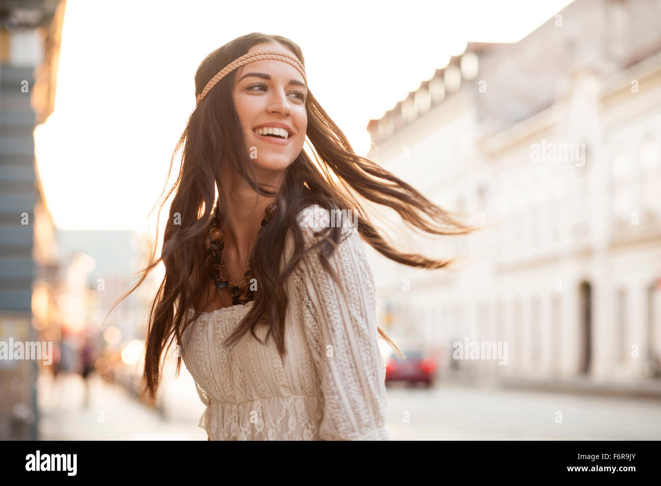 Young woman with tousled hair and headband Stock Photo