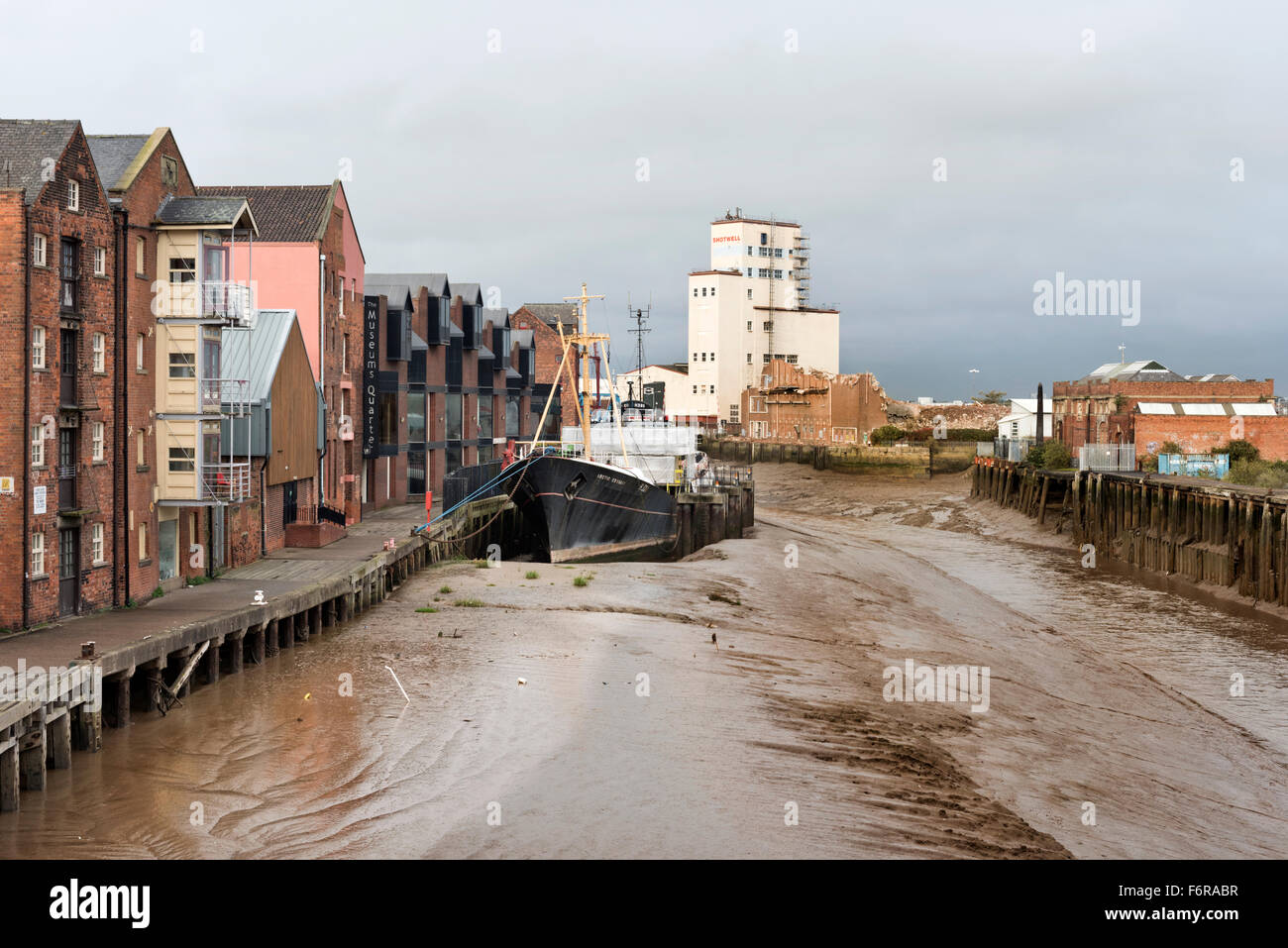 The River Hull, with the former trawler Arctic Corsair moored next to the Museum's Quarter and flats, Kingston upon Hull, UK. Stock Photo