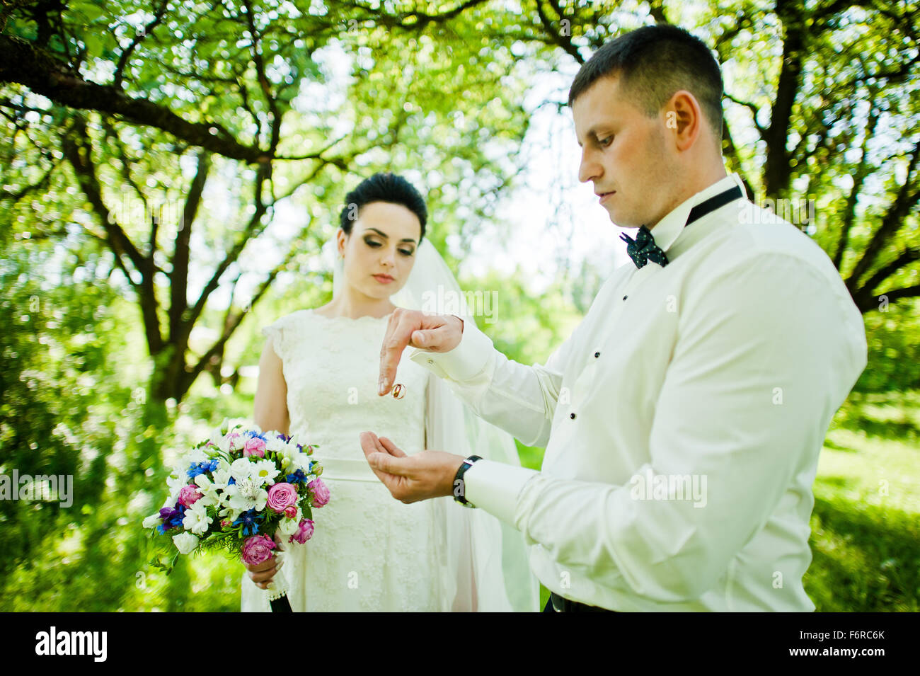 Groom throw wedding rings Stock Photo Alamy