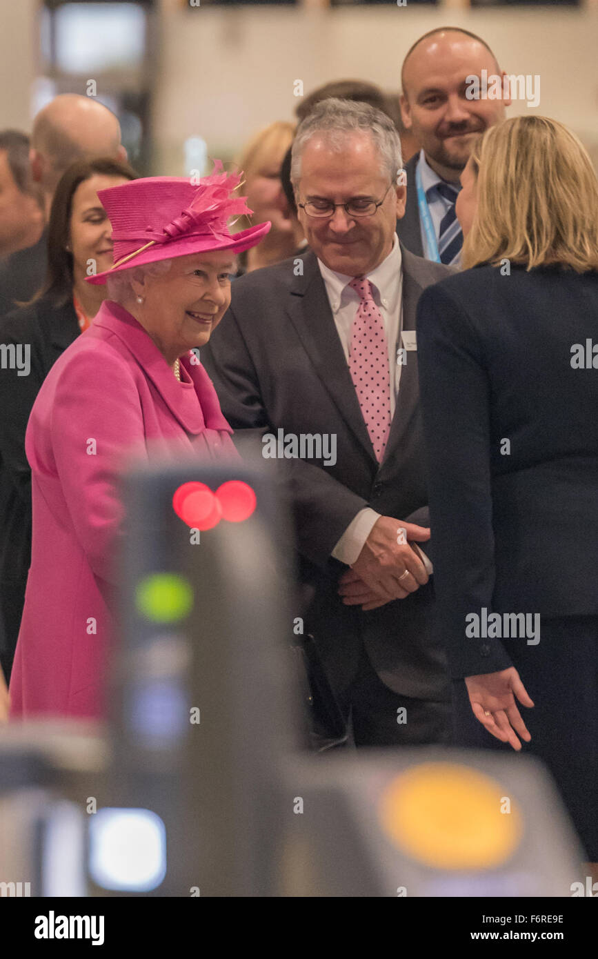Birmingham, UK. 19th November, 2015.  Amid tight security and a strong visual Police presence the Queen came to Birmingham today to officially reopen New Street Station she was greeted by a large crowd eager to catch a glimpse of her and a cheer went up as she came through the Station Credit:  David Holbrook/Alamy Live News Stock Photo