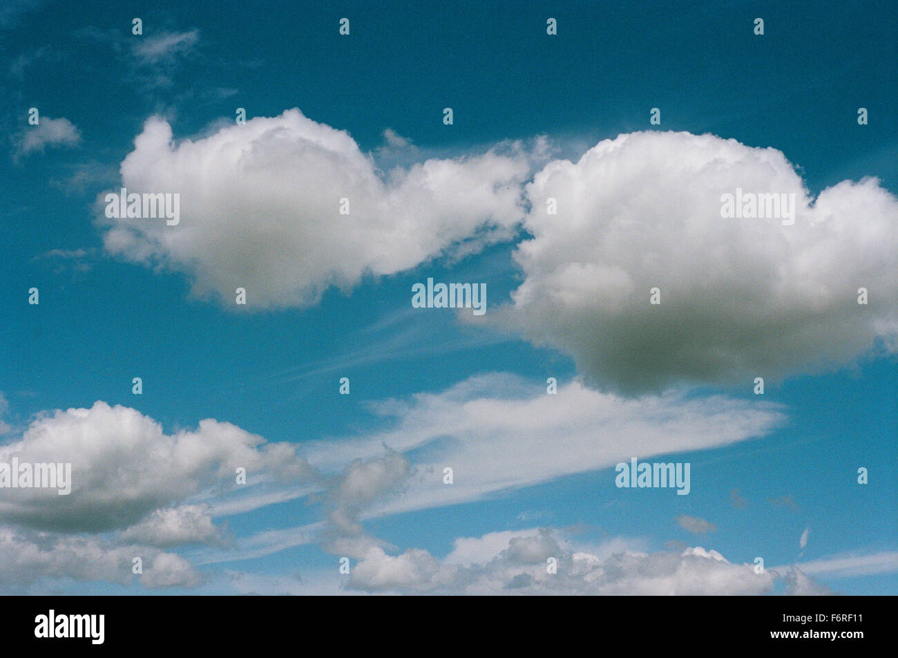 Blue Sky with fluffy clouds Stock Photo - Alamy