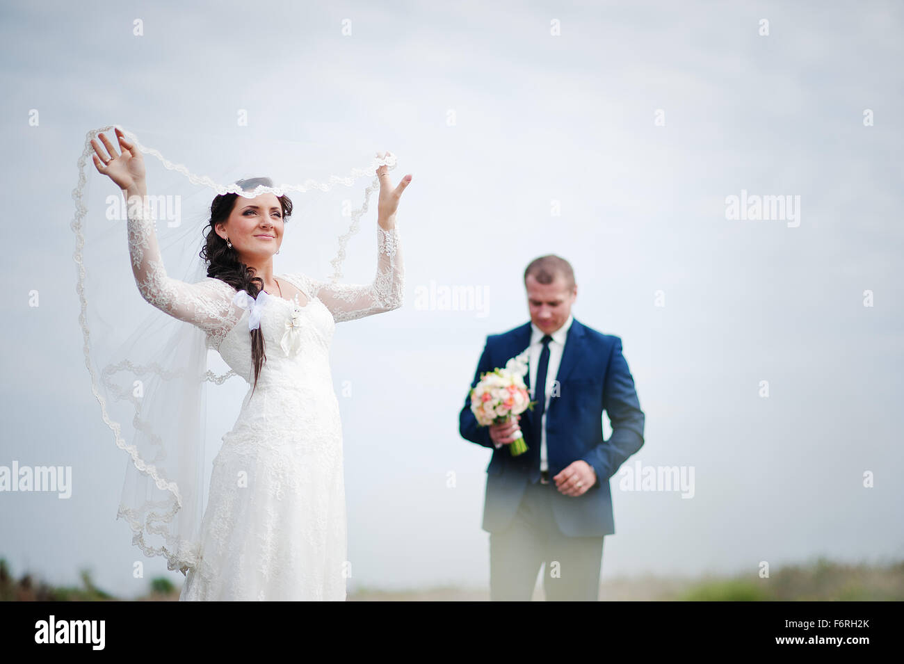 wedding couple background white sky Stock Photo - Alamy