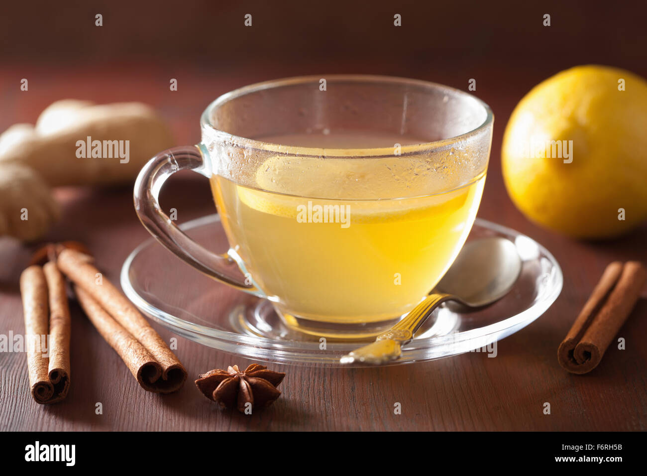 hot lemon ginger cinnamon tea in glass cup Stock Photo