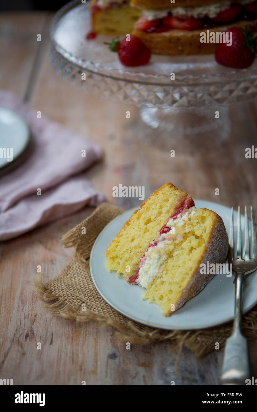 Slice of Victoria Sponge Cake with Fork Stock Photo